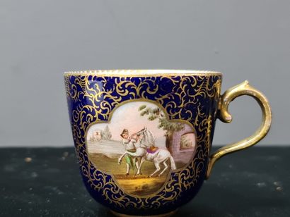null Cup and saucer in Meissen porcelain with blue and gold background decorated...