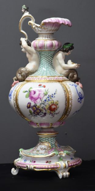 null Meissen porcelain ewer with tritons decoration supporting a handle ending with...