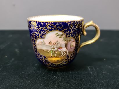 null Cup and saucer in Meissen porcelain with blue and gold background decorated...