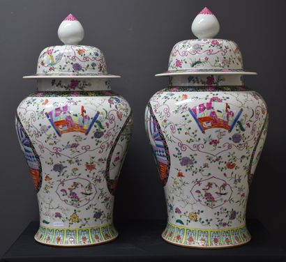 null A pair of Chinese porcelain covered potiches decorated with characters in reserves,...