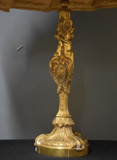 null Bronze candelabra in the Louis XIV style with tritons decoration. Mounted as...