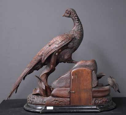 null 
Hunting clock end of the 19th century. Carved wood work of the Black Forest...