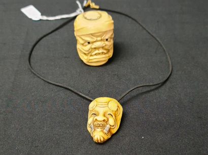 Japanese ivory bust and a Noh mask pendant....