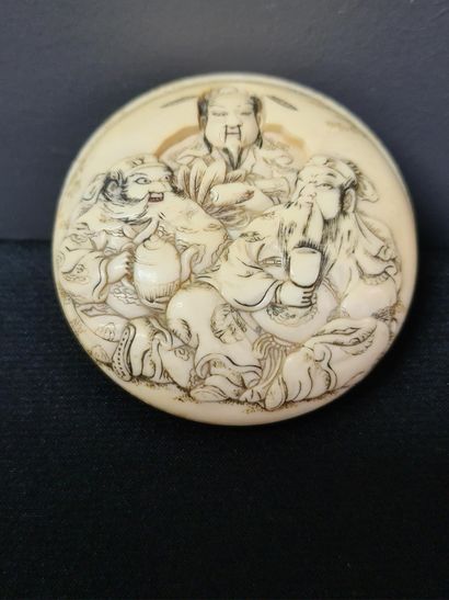 null Japanese ivory netsuke, "Monkey with water lily" and carved ivory disc with...