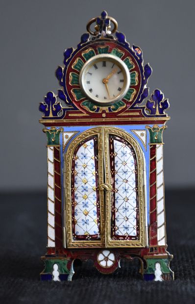 null A miniature cloisonné and enamelled bronze watch case. Two small doors open...