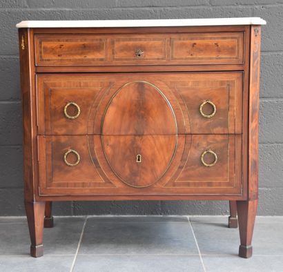 null A Louis XVI style mahogany veneered chest of drawers, French work around 1800....