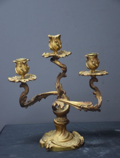 null A pair of ormolu candlesticks in rocaille style. French work around 1900. Height...