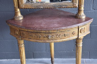 null Empire style giltwood corner console. Porphyry shelf. Height : 164 cm.