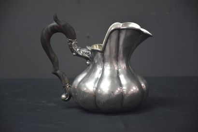 null Silver milk jug. Wooden handle. Belgian hallmarks between 1831 and 1868. Weight:...