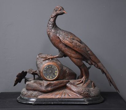 null 
Hunting clock end of the 19th century. Carved wood work of the Black Forest...