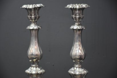 null A pair of silver rocaille style candlesticks. Austrian-Hungarian hallmarks 19th...