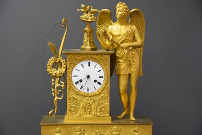 null A finely chased gilt bronze clock. Empire period with the goddess Niké personifying...