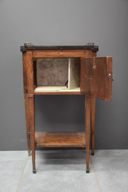 null Louis XVI style bedside table opening on a trompe-l'oeil door of fake books....