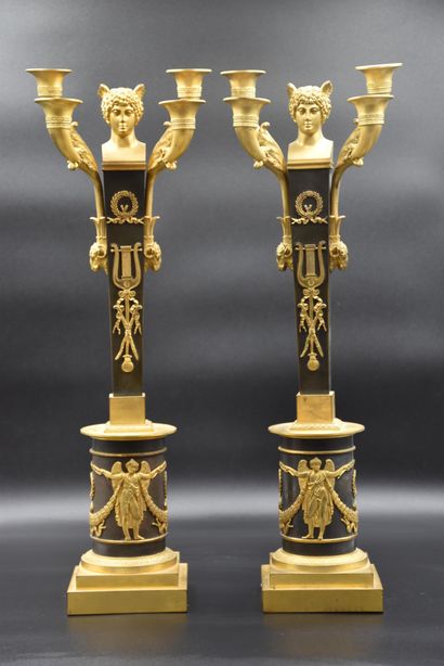 null A pair of Empire period candelabras topped with mercury busts. Attributed to...