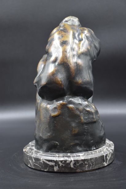 null 
Bronze figure holding his head in his hands.

Work around 1930.

Bears the...