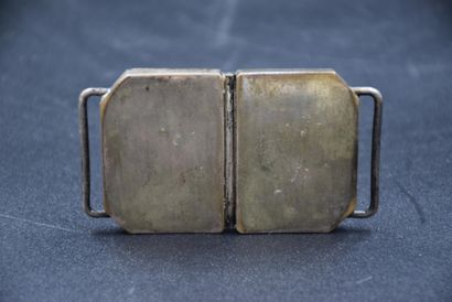 null Japan (1920-1930), worked ivory belt buckle with silver plated metal frame,...