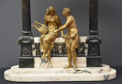 null Sculpture in bronze and marble making a lamp. Ancient figure and muse with a...