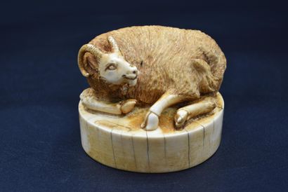 null Carved ivory seal representing a lying ibex, inscriptions underneath. Chinese...