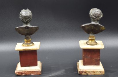 null Pair of antique bronze busts on square marble bases composed of three different...