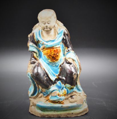 null Turquoise glazed stoneware Buddha. Late Ming period. Slightly missing. There...