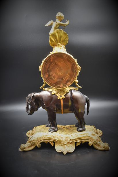 null An ormolu and patinated bronze clock with an elephant. French work at the end...