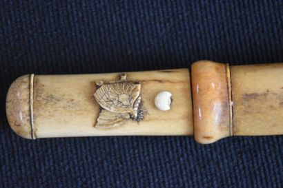 null Small 19th century bone Katana richly carved with peonies and butterflies. A...