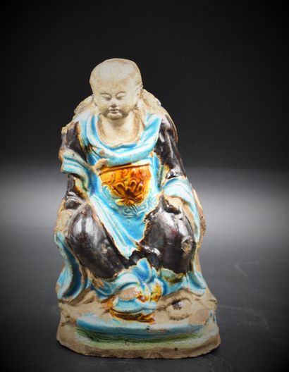 null Turquoise glazed stoneware Buddha. Late Ming period. Slightly missing. There...