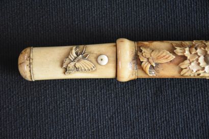 null Small 19th century bone Katana richly carved with peonies and butterflies. A...