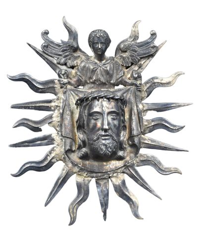 null 
Silver stoup with a head of Christ End of XIX th century. Ht : 21 cm. Old restorations...