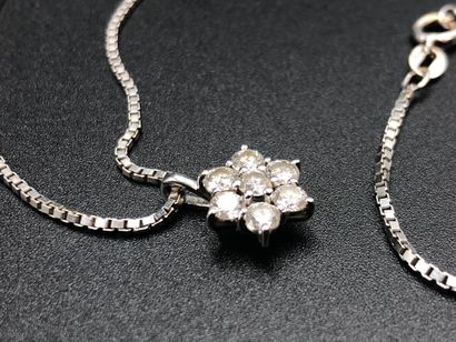 null White gold necklace and its small pendant decorated with 7 diamonds. Total weight:...