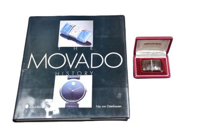 null Movado travel watch in its box. A book on the theme is attached. 

NL: Movado...