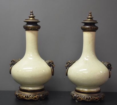 null Pair of celadon cracked porcelain lamps. Bronze mounting. Lids reported. Ht...