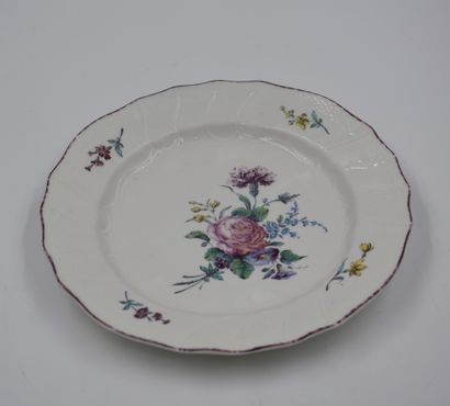 null Lot of four beautiful porcelain plates of Tournai including: A polychrome model...