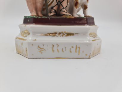 null St Roch en porcelaine de Bruxelles fin XIXème. Ht : 34 cm. Bâton en bois rapporté....