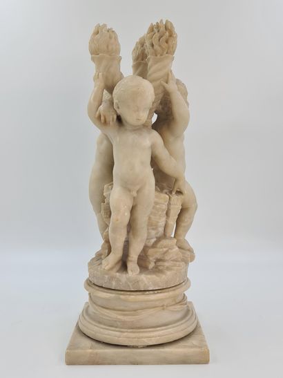 null Sculpture en albâtre représentant une ronde de trois putti adossés à des flambeaux....