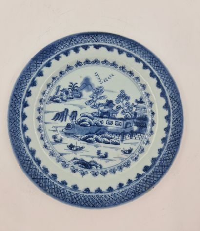 null Pair of white/blue Chinese porcelain plates decorated with landscapes and pagodas....