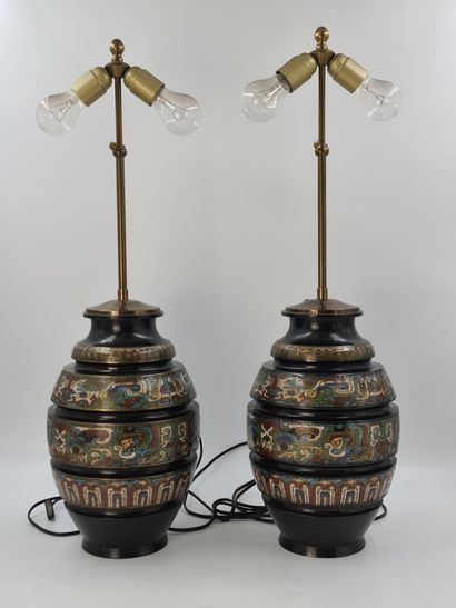 null Pair of bronze and polychrome champlevé enamel vases, the sides decorated with...