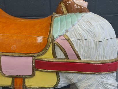null Carved wooden carousel bear decorated with a female face at the back of the...