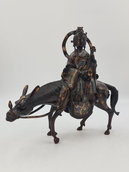 null Bronze and polychrome champlevé enamel group, representing the goddess Kannon...