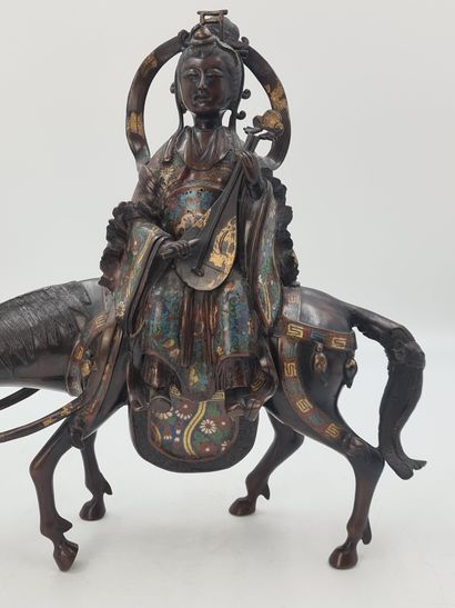 null Bronze and polychrome champlevé enamel group, representing the goddess Kannon...