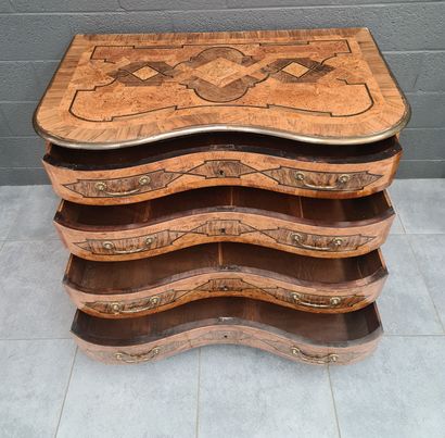 null Regency period Liège marquetry chest of drawers opening with four drawers. Bronze...