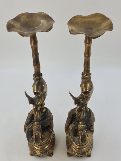 null Pair of large bronze candelabras representing a dragon and a carp supporting...
