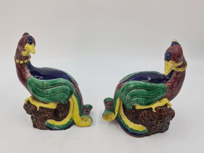 null Pair of brown, yellow, green and blue enamelled subjects, representing fenghuang...