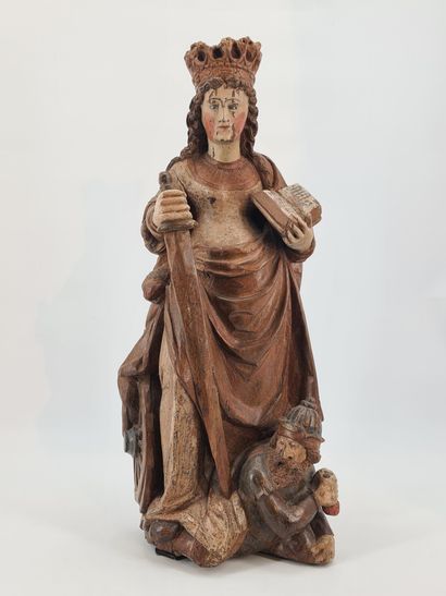 null Sainte Catherine d’Alexandrie en chêne sculpté et polychromé. Debout et la tête...