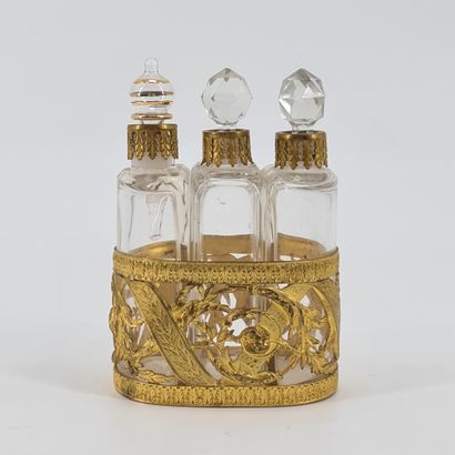 null Perfume bottle display, restoration style bronze frame. (A cork reported). Height:...