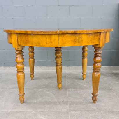 null Oval dining room table with three extensions resting on five turned legs. Tablet...