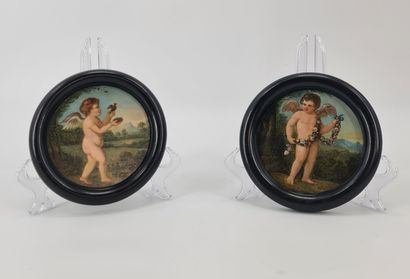 null Pair of 18th century oils on copper with loves. Diameters: 12 cm.
