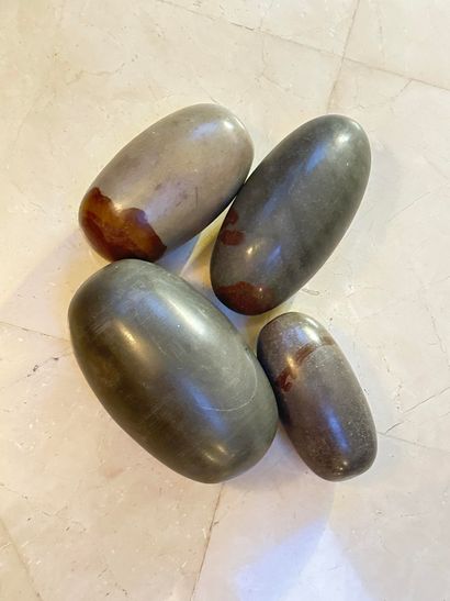 null India. Set of 4 stone shiva lingams. N.B. Shiva lingams are intended to protect...