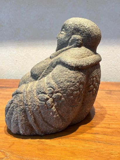 null China, early 20th century. Stone Buddha representing Milefo holding his rosary...