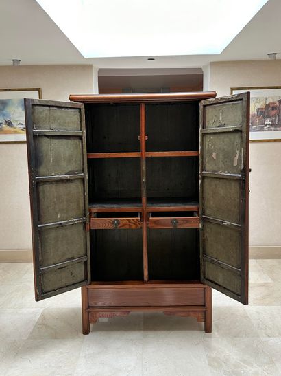 null China, early 20th century, Wooden cabinet with rounded corners, opening to two...